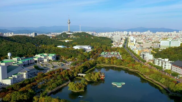 "Aerial view of 83 Tower behind an artificial lake in Daegu, Republic of Korea"