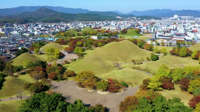 "Aerial view of Tumuli park containing several royal tombs in Gyeongju, Republic of Korea"