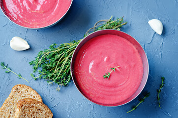 Potato Beet soup with Thyme in a bowl