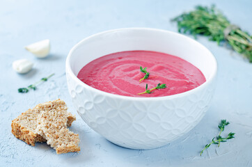 Potato Beet soup with Thyme in a bowl