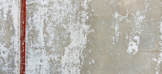 Grey old grunge concrete cement wall with painted drawing red graffiti line element. Urban street...