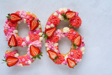 Birthday cake. Unusual modern design with strawberries. Spring time. Postcard for the holiday. Congratulations are bright and creative. Beautiful cake in the shape of number 96