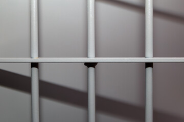 modern prison bars. Symbolic illustrative background for crime news