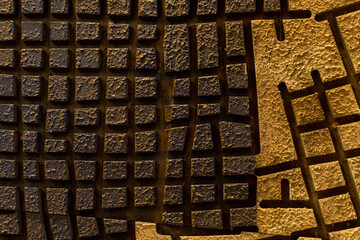 Decorative plaster imitating the maze scheme. Symbolic background.