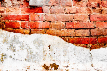 Texture of a brick wall with cracks and scratches which can be used as a background