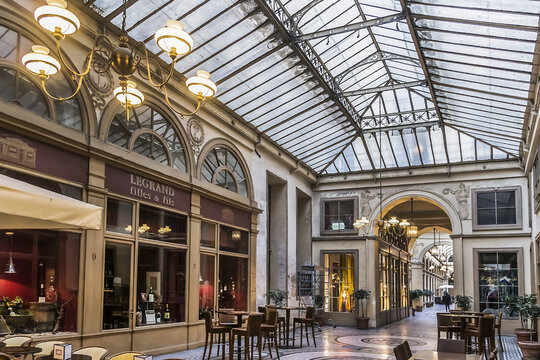 Interior of Galerie Vivienne (architect Francois-Jean Delannoy, 1823). Luxurious Vivienne Covered Passage is 176 meters long: shops, restaurants and tourist attraction. PARIS, FRANCE. March 8, 2015.