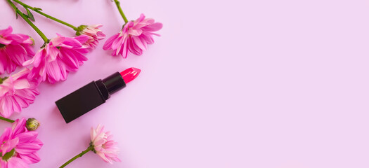 Obraz na płótnie Canvas lipstick flower on colored background