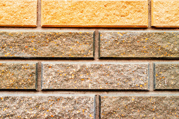 Texture of a brick wall with cracks and scratches which can be used as a background