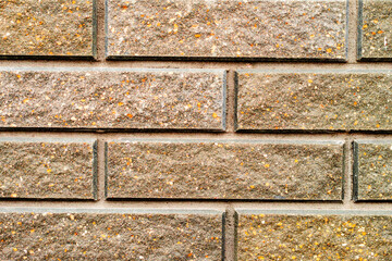 Texture of a brick wall with cracks and scratches which can be used as a background