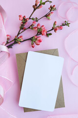 mockup greeting card from flowering branches, envelope and white blank for text 