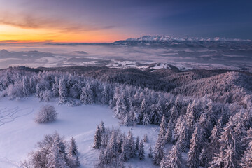 Winter morning in Gorce on the tower on the top of Lubań. A beautiful, romantic atmosphere with a view of the Pieniny Mountains, the Beskids and the Tatra Mountains.
