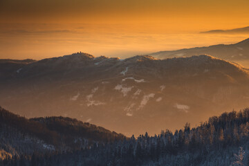 Winter morning in Gorce on the tower on the top of Lubań. A beautiful, romantic atmosphere with a view of the Pieniny Mountains, the Beskids and the Tatra Mountains.
