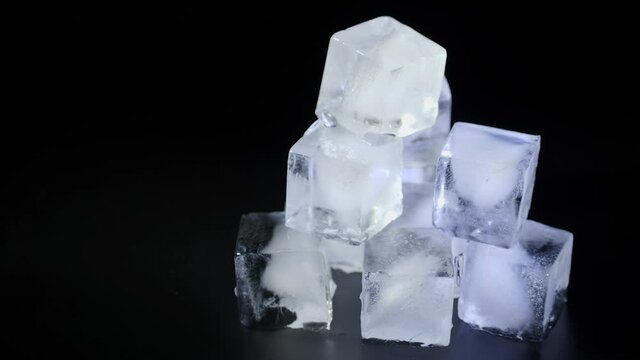 Ice cubes on a black background.