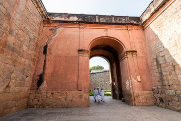 The arched entrance gateway to the ancient Bengaluru Fort in the old town area of the city.