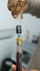 hand holding syringe