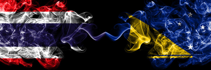 Thailand, Thai vs New Zealand, Tokelau smoky mystic flags placed side by side. Thick colored silky abstract smokes flags.