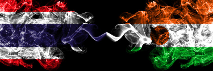 Thailand, Thai vs Niger, Nigerien smoky mystic flags placed side by side. Thick colored silky abstract smokes flags.