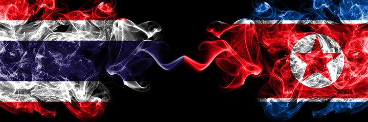 Thailand, Thai vs North Korea, Korean smoky mystic flags placed side by side. Thick colored silky abstract smokes flags.