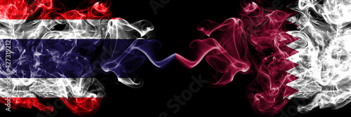 Thailand, Thai vs Qatar, Qatari smoky mystic flags placed side by side. Thick colored silky abstract smokes flags.