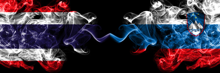 Thailand, Thai vs Slovenia, Slovenian smoky mystic flags placed side by side. Thick colored silky abstract smokes flags.