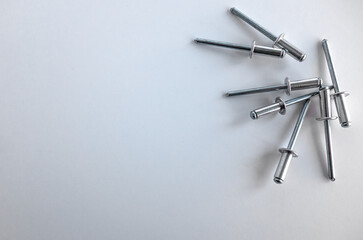 Aluminum rivets in silver color on a white background