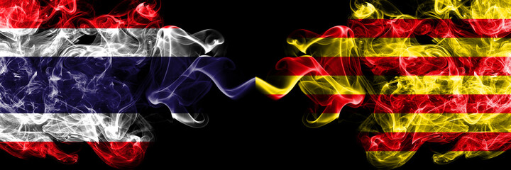 Thailand, Thai vs Spain, Spanish, Catalonia, Senyera smoky mystic flags placed side by side. Thick colored silky abstract smokes flags.