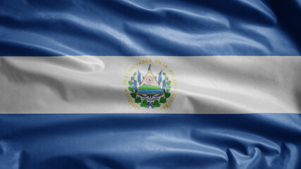 Salvadorean flag waving in the wind. Close up Salvador banner blowing soft silk.