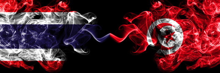 Thailand, Thai vs Tunisia smoky mystic flags placed side by side. Thick colored silky abstract smokes flags.