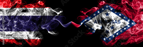 Thailand, Thai vs United States of America, America, US, USA, American, Arkansas, Arkansan smoky mystic flags placed side by side. Thick colored silky abstract smokes flags.