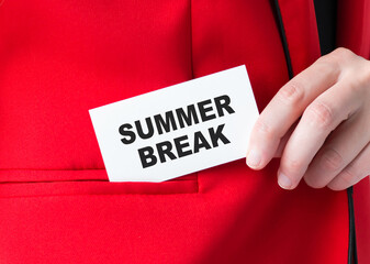 SUMMER BREAK text on a white business card in the hands of a businessman, which he puts in the pocket of a red jacket. Business, financial concept.