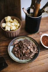 large and small pieces of chocolate. grated chocolate for making dessert. white and dark chocolate. crushed chocolate. pieces of white and dark chocolate top view. chocolate and cocoa macro photo