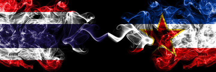 Thailand, Thai vs Yugoslavia, Yugoslavian smoky mystic flags placed side by side. Thick colored silky abstract smokes flags.