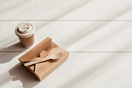 Hot coffee on the go and lunch box. Biodegradable, disposable takeaway coffee and tea cup