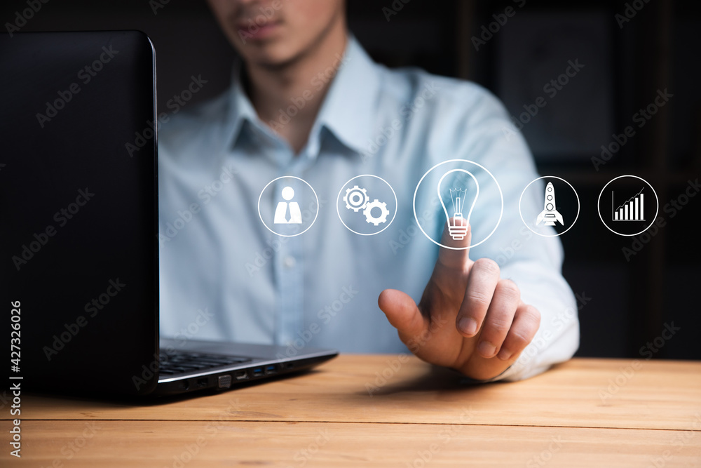 Aufkleber man working computer with start up icons