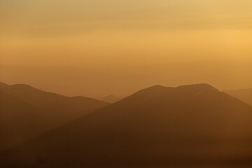 Travel across the Primorsky Territory. View of the valley from the top of the mountain during a golden sunset.
