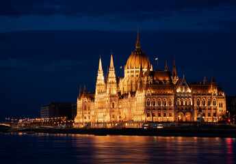 Fototapeta na wymiar Hungary, Budapest city at night, parliament by the river, reflection of lights in the water