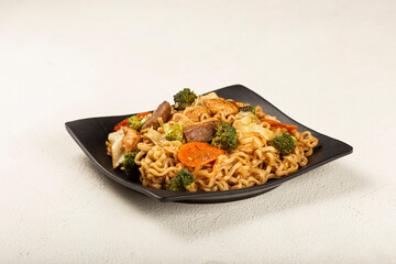 Yakisoba noodles. Yakisoba dish with meat, chicken and vegetables.