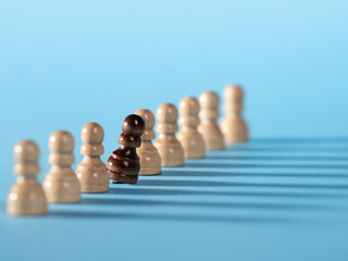 chess pieces in a row, white pawns on a blue background,
