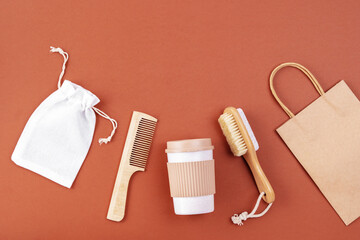 Zero waste kit flat lay, reusable mug for takeaway, sustainable style of life. Personal hygiene accessories from bamboo and wooden material. Plastic free, eco friendly concept