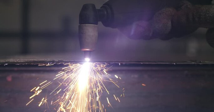 Locksmith cuts metal with a plasma cutter, metalcutting by gas cutter with sparks, 4k Prores HQ