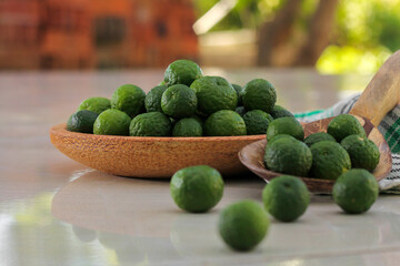 kaffir lime on a coconut wood plate