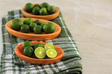 kaffir lime on a coconut wood plate