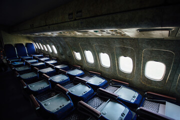 Inside of old abandoned passenger airplane. Plane wreck