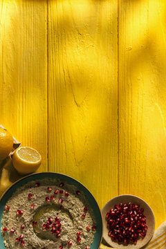 Baba ganoush or mutabal, Middle Eastern eggplant dip sauce garnished with pomegranate seeds, with various ingredients