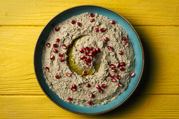 Baba ganoush or mutabal, Middle Eastern eggplant dip sauce garnished with pomegranate seeds