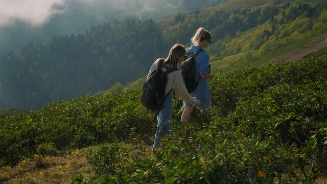 Girls backpackers in the highlands