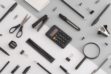 Pattern composition of office and school stationery on white, grey background. Back to school