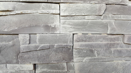 Gray textured stone wall. Building and renovation concept