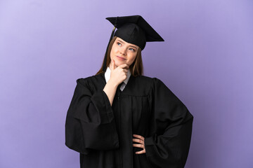 Young university graduate over isolated purple background having doubts