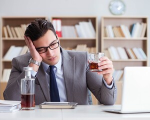 Businessman drinking in the office